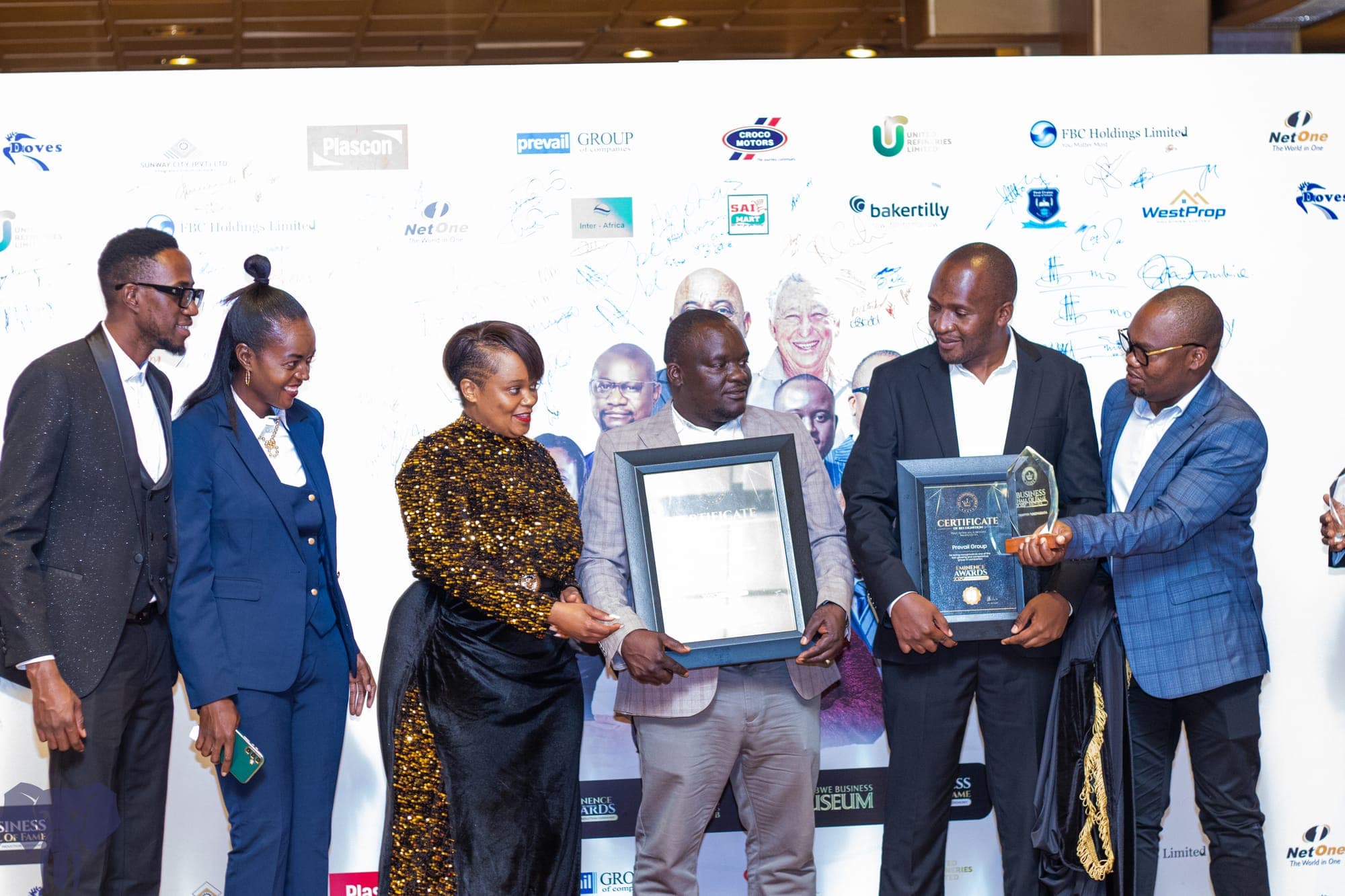 Prevail Group team receiving multiple awards at ceremony